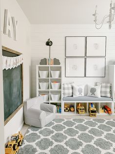 a child's playroom with toys, bookshelves and pictures on the wall