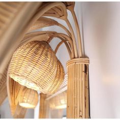 the light fixture is hanging from the ceiling in the room with wicker shades on it