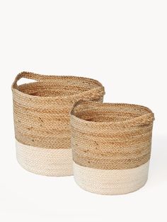 two woven baskets with handles on white background