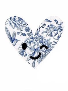 a blue and white heart with flowers on it