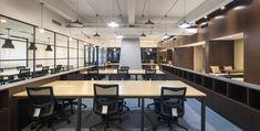 an empty conference room with desks and chairs