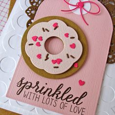 a pink card with a donut on it and the words sprinkled with lots of love