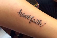 a person with a tattoo on their arm that reads, have faith and has the word jesus written in cursive font