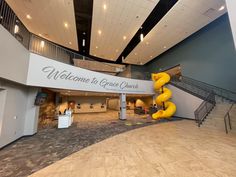 the entrance to grace church is decorated in yellow and white with stairs leading up to it