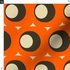 an orange and black pattern with white circles