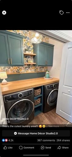 an image of a laundry room with green cabinets and washer and dryer in it