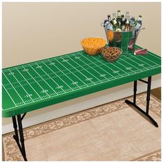 a football field table with snacks and drinks on it