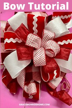 a red and white bow that is on top of a pink background with the words how to make a bow