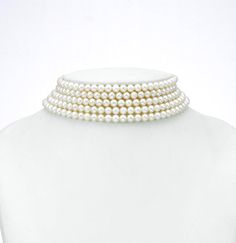 The Elegant White Pearl Choker Set is a classic statement of timeless beauty. Featuring pristine white pearls, this choker gracefully wraps around the neck, exuding sophistication and grace. Each pearl is carefully selected for its lustrous sheen, creating a harmonious blend that radiates elegance. Paired with matching pearl earrings, this set is perfect for weddings, formal events, or adding a touch of refinement to any outfit. The choker's simple yet luxurious design makes it a versatile piece that embodies understated luxury The necklace is designed to elegantly drape the neck, accentuating its wearer with a subtle yet captivating allure. A matching pair of earrings completes the set.  Note: Please note that there are no returns, exchanges or cancellations on precious pearls and other j Luxury White Formal Choker, Elegant Pearl White Choker Jewelry, Elegant Pearl White Choker With Pearl Chain, Luxury Pearl White Choker Jewelry, White Pearl Chain Choker, Luxury Elegant Pearl White Choker, Freshwater Cultured Pearls, Pearl Choker, Pearl Color