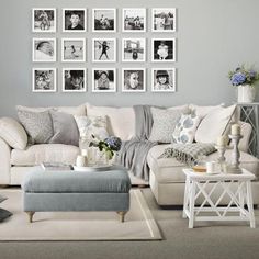 a living room filled with lots of furniture and pictures on the wall above it's coffee table