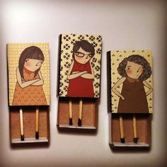 three matchesticks with pictures of people on them, one is holding a woman's hand