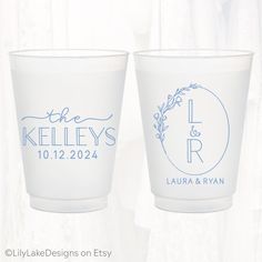 two shot glasses with the names and date printed on each one, sitting side by side