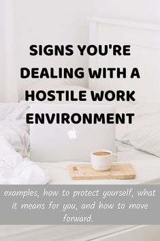 a laptop computer sitting on top of a bed with the words signs you're dealing with a hositie work environment