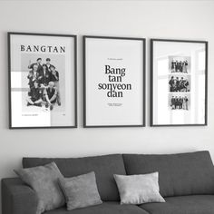 three black and white posters hang on the wall above a couch