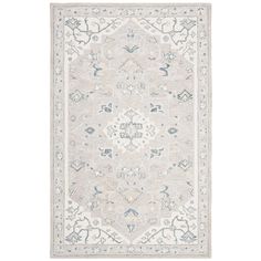 a beige and blue rug with an intricate design on the bottom, in front of a white background