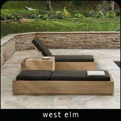 a couch sitting on top of a stone patio