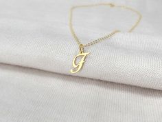 "A dainty initial letter necklace with any letter cut out. You can choose the length of your necklace and the type of metal you would like it made out of. The metal options are silver, gold or rose gold. The initial pendant is about 15 mm tall, so it is very dainty and cute! It makes the perfect everyday necklace.  DETAILS Metal: Silver, Gold or Rose Gold Chain: 16\", 18\", 20\" PROCESS 1. Choose your metal and chain length in the drop down menu 2. Write the initial or initials you would like for your order in the personalization box 3. Place your order 4. Ships out in 1-2 business days! Please reach out with any questions you may have! See our shop for many more designs! https://www.etsy.com/shop/SincerelySilverShop" F Initial, Letter Necklace Gold, Gold Letter Necklace, Initial Pendant Necklace, Rose Gold Chain, Everyday Necklace, Necklace Dainty, Initial Letter, Initial Pendant