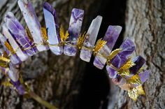 This beautifully hand wrapped amethyst crystal crown crystal tiara is a MUST for all goddesses alike. Embody your power and your essence by accentuating and extending the expression of your goddess-hood! These crowns are perfect for gatherings, ceremonial work, ritual work, or any type of occasion you so well please! These are also great for women circles to invoke and evoke the goddess energy and play in the Magick! Addtionally, Amethyst is known for its grounding energy that creates balance and the ability to tap into the energy that can manifest as creativity and productivity. Amethyst is undoubtedly the most powerful gemstone to use if one wants to achieve clarity, channel inner psychic energies, and undergo a meaningful spiritual transformation. It is a semi adjustable band that shoul Tiara Gold, Crown Crystal, Grounding Energy, Crystal Tiara, Women's Circle, Spiritual Transformation, Goddess Energy, Crystal Tiaras, Crystal Crown