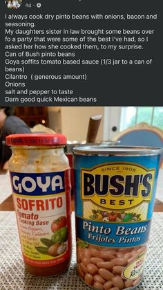 two jars of food sitting on top of a table next to an open can of beans