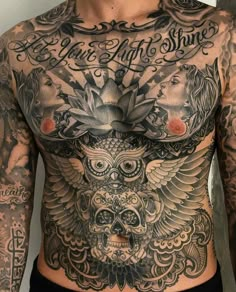 a man with tattoos on his chest has an owl and flower tattoo on his chest