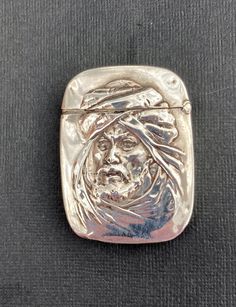 Very Rare antique late 19th century sterling silver vesta. Wonderful embossed portrait of Orientalist man in traditional head gear and beard. It is in good condition with some signs of age and use. This a very unusual vesta making it ideal for any collection. On the back it is engraved with 3 letters and it is marked sterling on the inner lip . Dimensions 6cm x 4.4cm x 0.9cm. Oc Challenge, Head Gear, Vintage Bakelite, Hand Mirror, Rare Antique, Velvet Fabric, Sterling Silber, Aging Signs, Very Rare