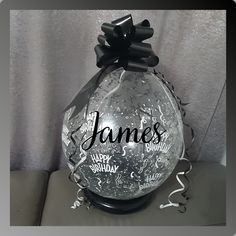 a glass vase with the name james on it