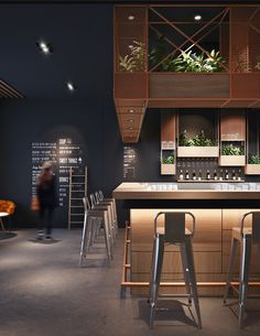 a bar with stools and plants on the wall