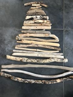 a christmas tree made out of driftwood sticks