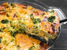 broccoli and cheese quiche with a slice missing