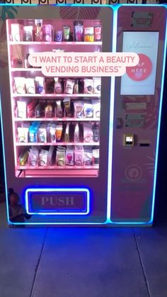 a vending machine that is lit up with neon lights and the words, i want to start a beauty vending business