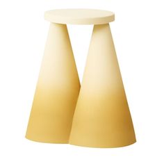 two yellow and white lamps sitting on top of each other