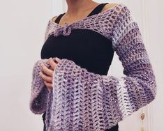 This shrug is a unique accessory to style in winter and spring. One Size Spring Wrap Shrug, Chic Wrap Shrug For Fall, Chic Fall Wrap Shrug, Fitted Wrap Shrug For Fall, Spring Long Sleeve Shrug One Size, Bohemian Long Sleeve Spring Shrug, One Size Wrap Shrug For Fall, One Size Long Sleeve Winter Shrug, Bohemian Fitted Shrug For Winter