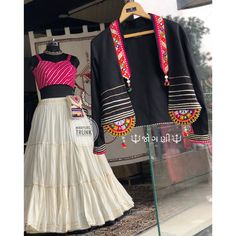 🔱જોગણી🔱  This Look completely different and authentic “CHANIYACHOLI”   Lehengas:- rayon cotton black fabric with 8 to 15  miter flair   Blouse:- Rani pink laheriyu georgette fabric with Gota lace work.  Jacket:-black jam cotton fabric with katchhi chain embroidery with intricate “satari” and “pearl”embroidery ., looking traditional with colour full wool  “જોગણી” @MAYURS_TRUNK   #navratrichaniyacholi #garba #gujarati #navratricollection#navratrilehenga #navaratri #navratrispecial #garbalover Garba Dress Gujarati, Choli Ideas, Gujarati Chaniya Choli, Chain Embroidery, Rani Pink