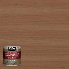 a can of behr waterproofing stain and sealer on a wooden floor