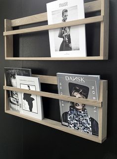 two wooden shelves with books and magazines on them