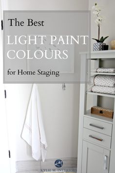 the best light paint colors for home staging in this white bathroom with shelving unit and towel rack