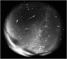 a black and white photo of stars in the night sky, taken from above with a telescope lens