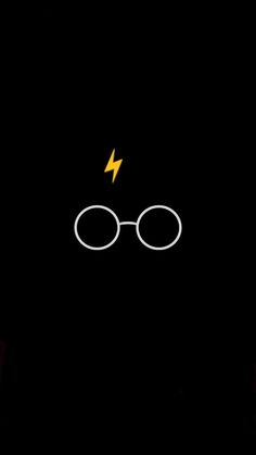 the harry potter logo is lit up in the dark with a lightning bolt coming out of it