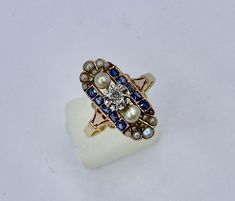 For Sale on 1stDibs - This is an absolutely stunning Old Mine Cut Diamond, Natural Sapphire and Pearl, Platinum and Gold Antique Art Deco - Victorian Wedding Engagement Ring. Antique Multi-stone Sapphire Wedding Ring, Heirloom Multi-stone Sapphire Ring For Wedding, Engagement Ring Victorian, Sapphire And Pearl, Victorian Engagement Rings, Old Mine Cut Diamond, Victorian Wedding, Wedding Engagement Ring, Platinum Wedding