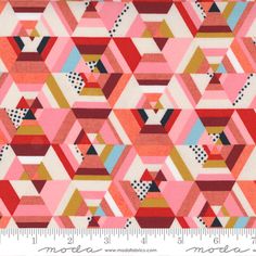 a pink and red geometric pattern on fabric