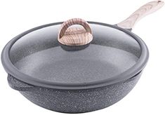 an empty pan with a wooden handle