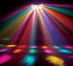 the lights are shining brightly on the floor in front of it's colorful colors