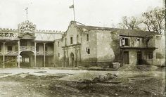 an old black and white photo of a building