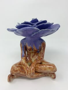 a blue vase sitting on top of a wooden table