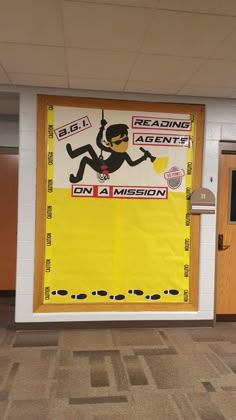 a bulletin board with an image of a man on a mission hanging from the ceiling