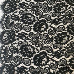 a black and white lace fabric with an intricate design