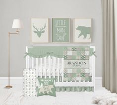 a baby's room with green and white decor, including a crib bed