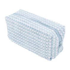 a blue and white wash bag on a white background