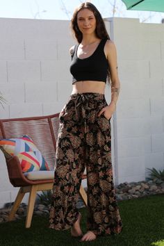 Angie Floral Print Waist Tie Summer Pants - Black – Debra's Passion Boutique Bohemian High-waisted Wide Leg Pants With Floral Print, Hippie Wide-leg Bottoms With Floral Print, Flowy Pants Outfit, Floral Print Non-stretch Wide-leg Pants, Bohemian Wide-leg Pants With Floral Print, Festival Floral Print Wide-leg Pants, Leg Belt, Lightweight Pants, Flowy Pants