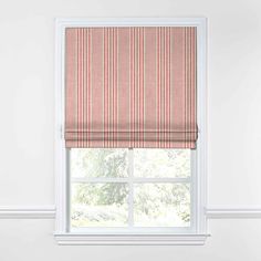 a pink roman blind in front of a window with red and white stripes on it